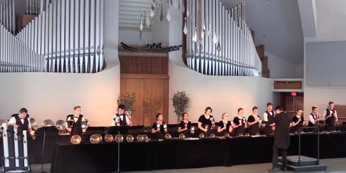 handbell performers in the CU center